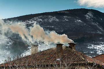 Image showing Chimney of the house and smoke