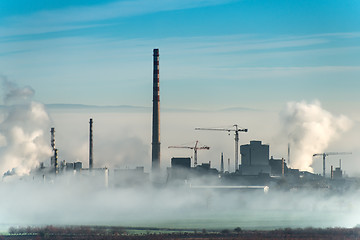 Image showing Factory chimneys and clouds of steam