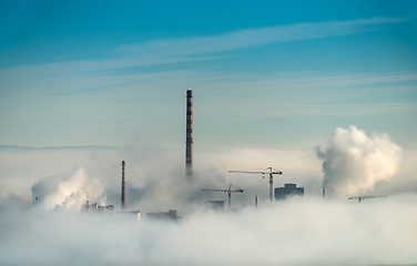 Image showing Factory chimneys and clouds of steam