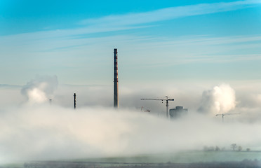 Image showing Factory chimneys and clouds of steam