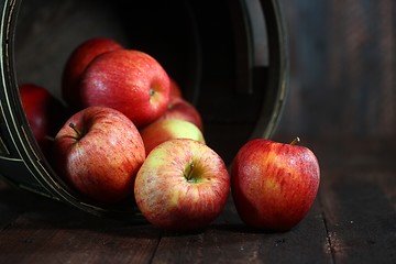 Image showing Homey Barrel Full of Red Apples on Wood Grunge  Background
