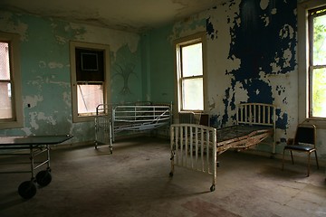 Image showing Delapidated Hospital Building With Empty Rusted Beds