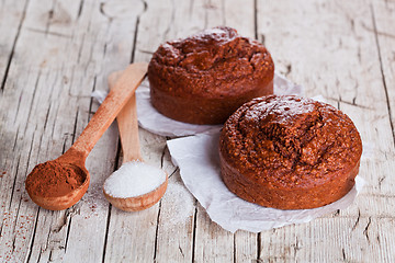 Image showing fresh baked browny cakes, sugar and cocoa powder