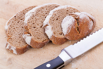 Image showing homemade fresh baked bread and knife 