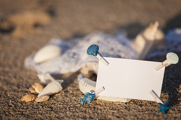 Image showing sailing boat and seashell in sand decoration closeup