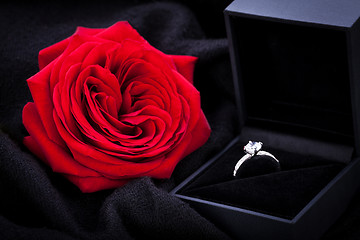 Image showing red rose and diamond ring in a box 