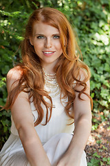 Image showing beautiful smiling young redhead woman portrait outdoor