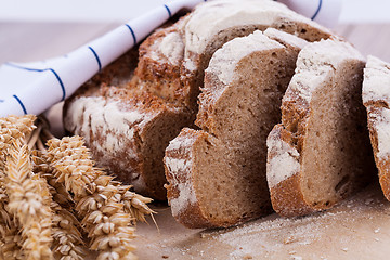 Image showing homemade fresh baked bread and knife 