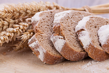 Image showing homemade fresh baked bread and knife 