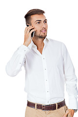 Image showing Handsome man reading a message on his mobile