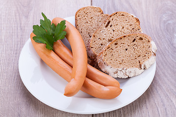 Image showing tasty sausages frankfurter with grain bread 