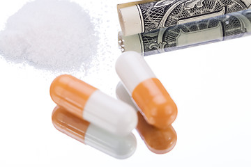 Image showing illegal pharmaceutical pills and drugs money on mirror