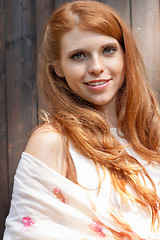 Image showing beautiful smiling young redhead woman portrait outdoor