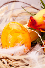 Image showing Vivid orange Easter egg with a gerbera and rose