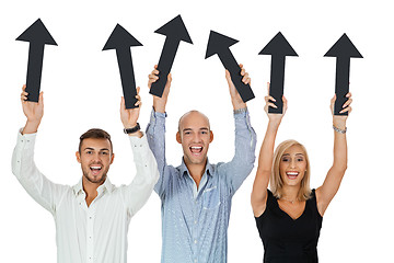 Image showing happy people showing up black arrows isolated 