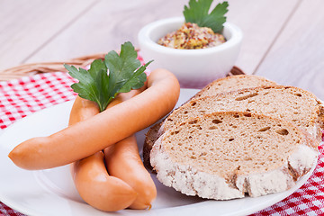 Image showing tasty sausages frankfurter with grain bread 