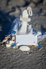 Image showing sailing boat and seashell in sand decoration closeup