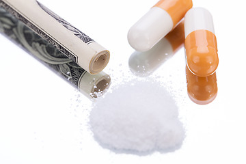 Image showing illegal pharmaceutical pills and drugs money on mirror