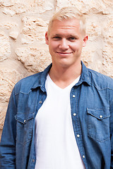 Image showing attractive young adult man standing outside 