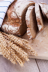 Image showing homemade fresh baked bread and knife 