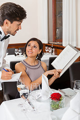 Image showing young smiling couple at the restaurant 