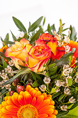 Image showing Vivid orange gerbera daisy in a bouquet