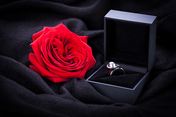 Image showing red rose and diamond ring in a box 