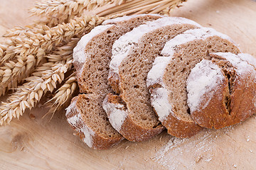Image showing homemade fresh baked bread and knife 