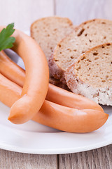 Image showing tasty sausages frankfurter with grain bread 