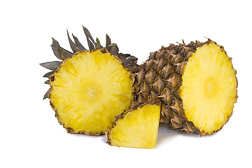 Image showing Pineapple and slices of pineapple on a white background.