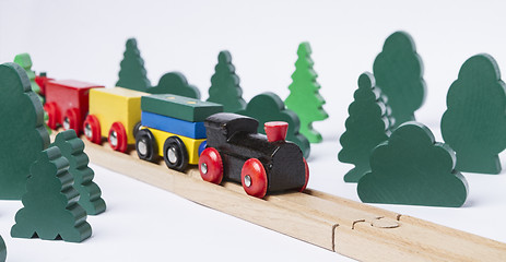 Image showing wooden toy train in rural landscape