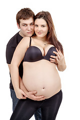 Image showing loving happy couple, pregnant woman with her husband, isolated o