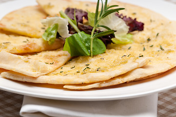 Image showing garlic pita bread pizza with salad on top