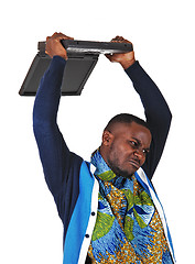 Image showing Black man throwing his laptop.