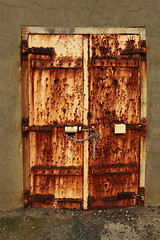 Image showing Rusty padlocked door