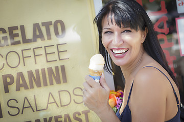 Image showing Pretty Italian Woman Enjoying Her Gelato at the Street Market.