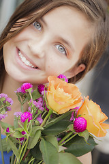 Image showing Pretty Young Girl Holding Flower Bouquet at the Market