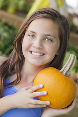 Image showing Pretty Young Girl Having Fun with the Pumpkins at Market