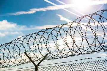 Image showing fence with barbed wire