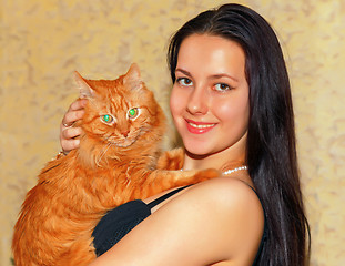 Image showing Young girl with a red cat