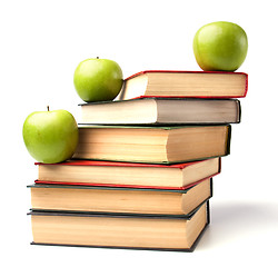 Image showing book stack with apple isolated on white background 