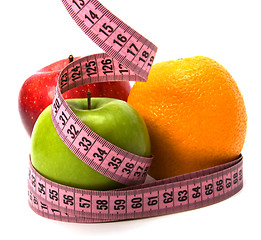 Image showing  tape measure wrapped around fruits isolated on white background