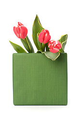 Image showing gift with pink tulips  isolated on white background