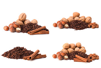 Image showing grated chocolate, nuts and cinnamon isolated on white background