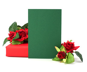 Image showing Gift with floral decor. Flowers are artificial. 