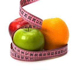 Image showing  tape measure wrapped around fruits isolated on white background