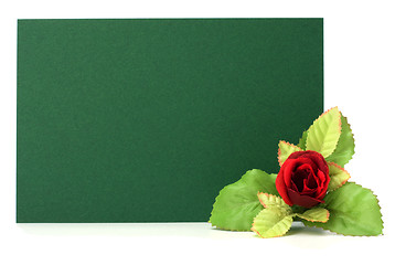 Image showing Card with floral decor. Flowers are artificial. 