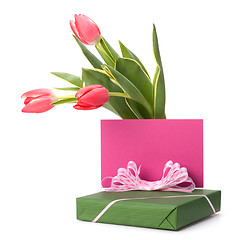 Image showing gift with pink tulips  isolated on white background