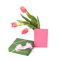 Image showing gift with pink tulips  isolated on white background