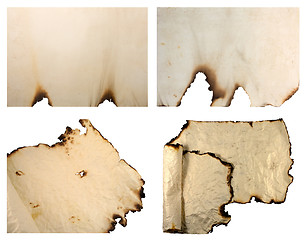 Image showing Collection of burnt vintage paper isolated on white 